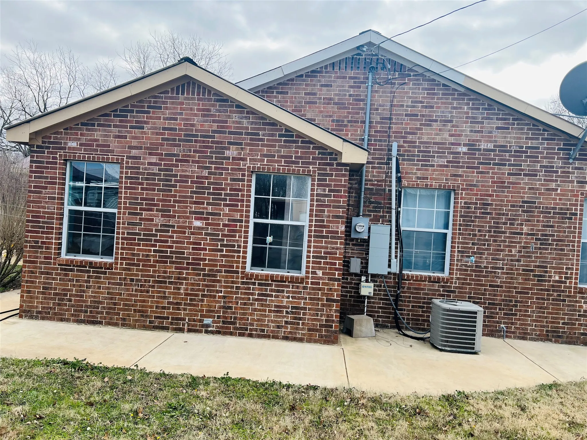 Back of house featuring a patio and central AC