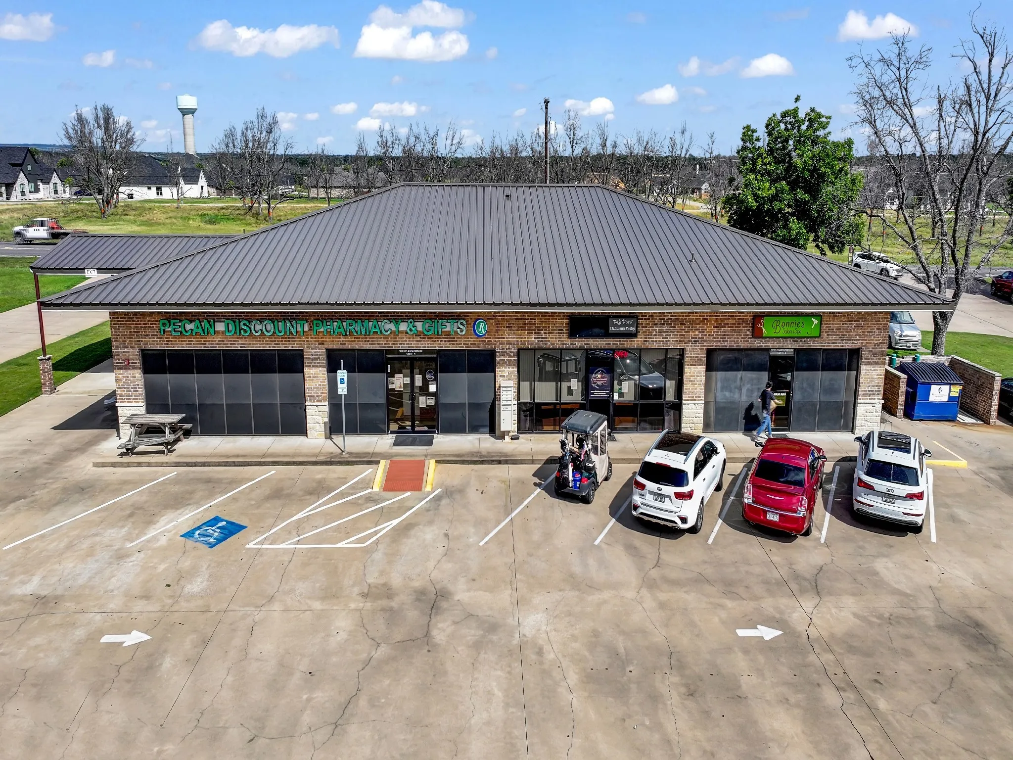 View of commercial location with uncovered parking