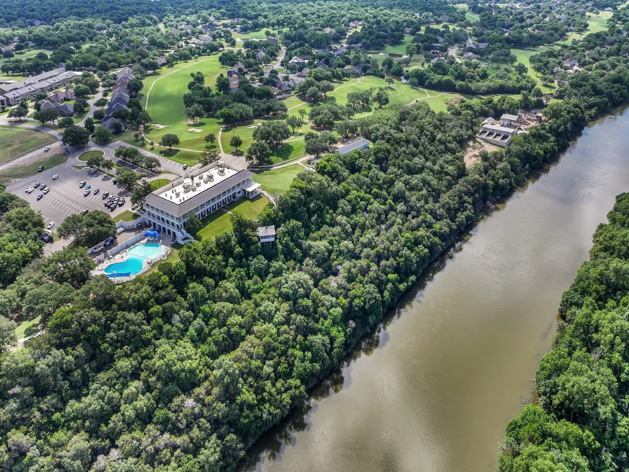 Aerial view of a large body of water and a local golf course