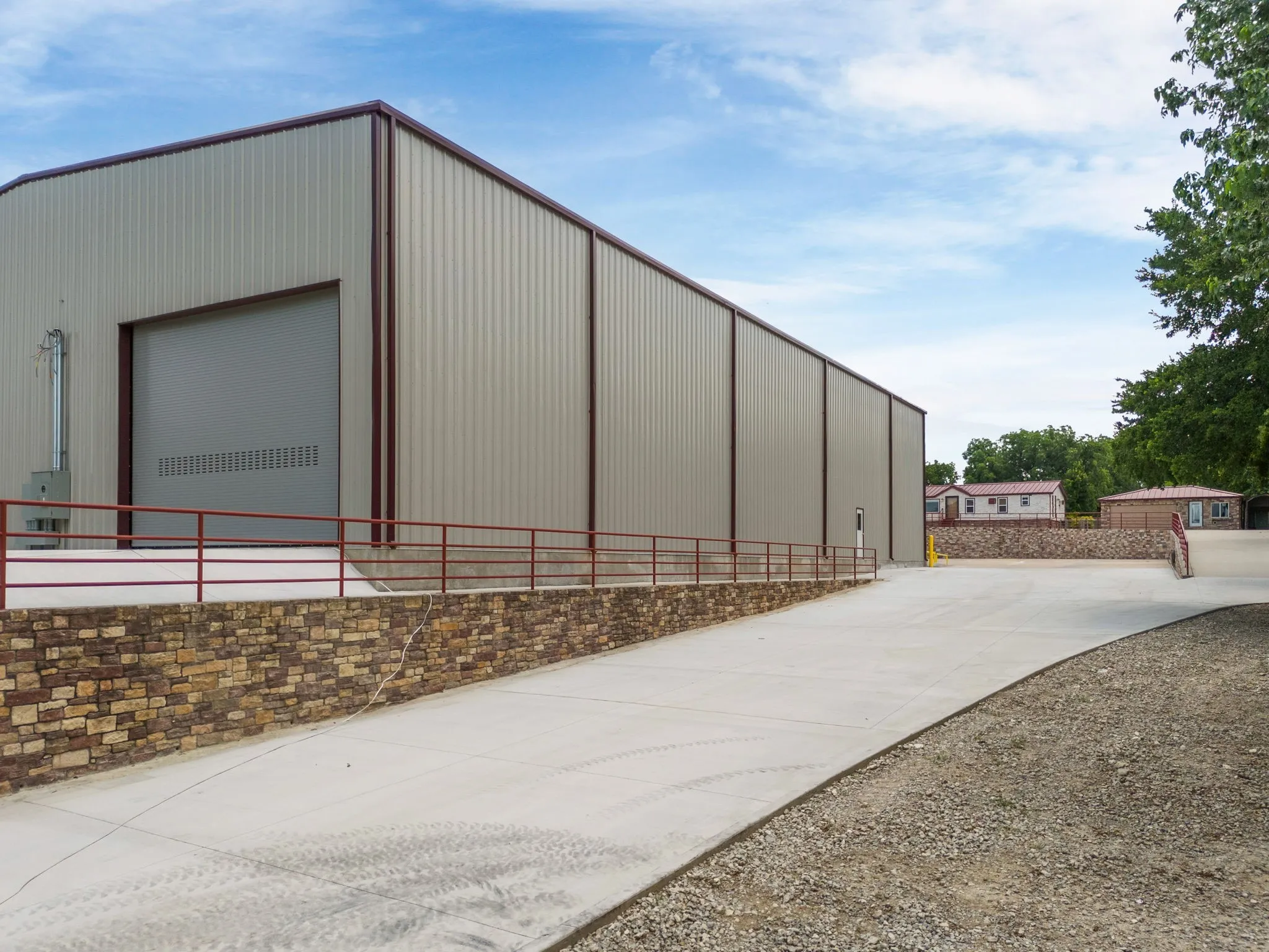 View of Warehouse and Driveway with a Curb