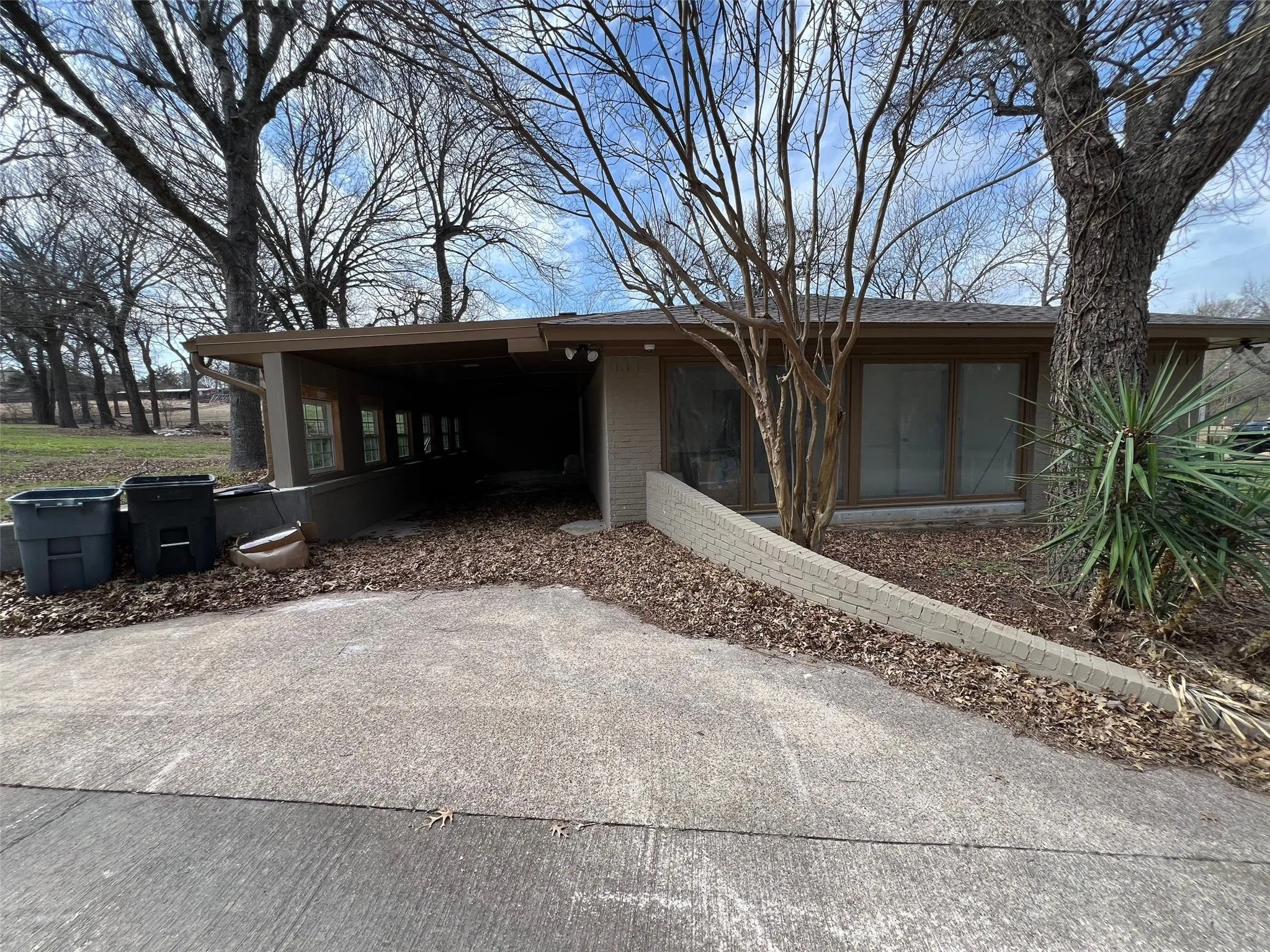 View of front of house featuring a carport