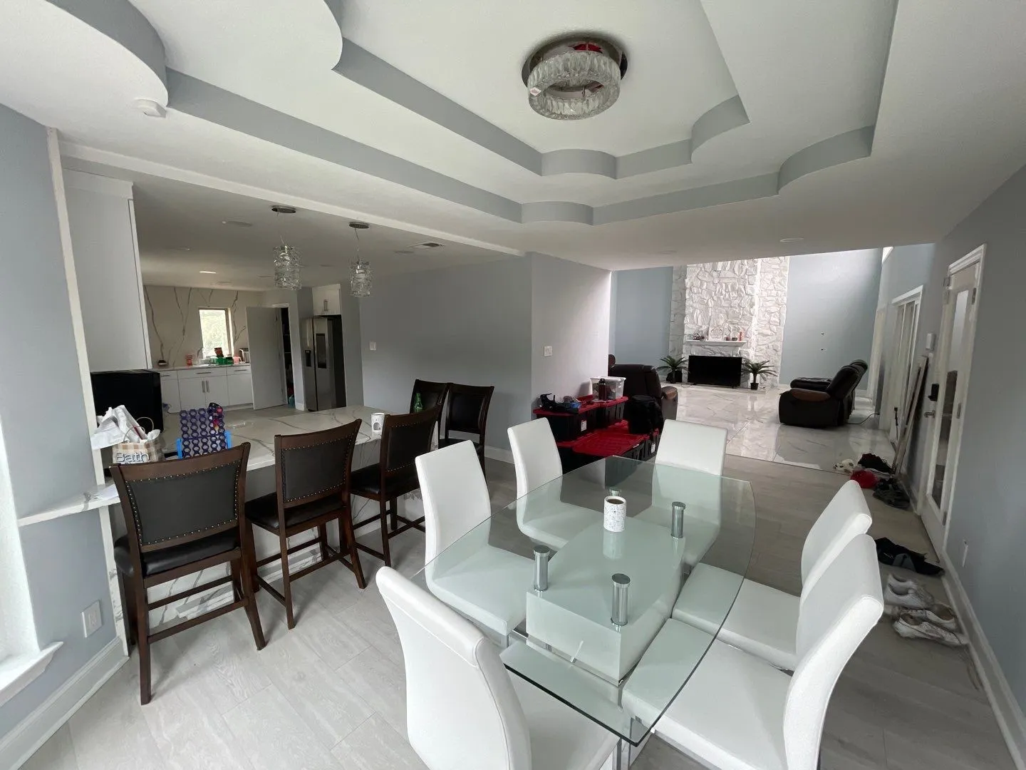 Dining room featuring a fireplace and a tray ceiling