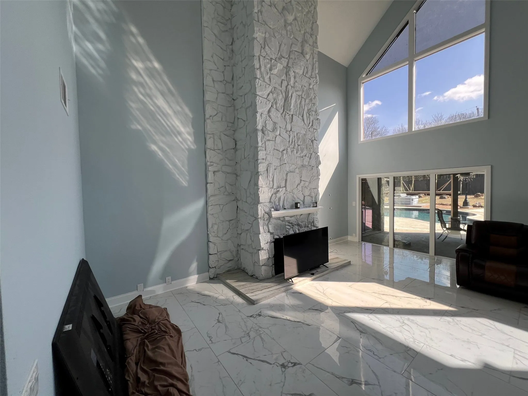 Living room with high vaulted ceiling