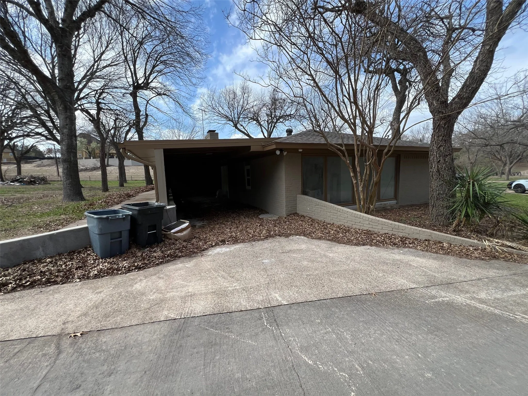 View of front of house featuring a carport