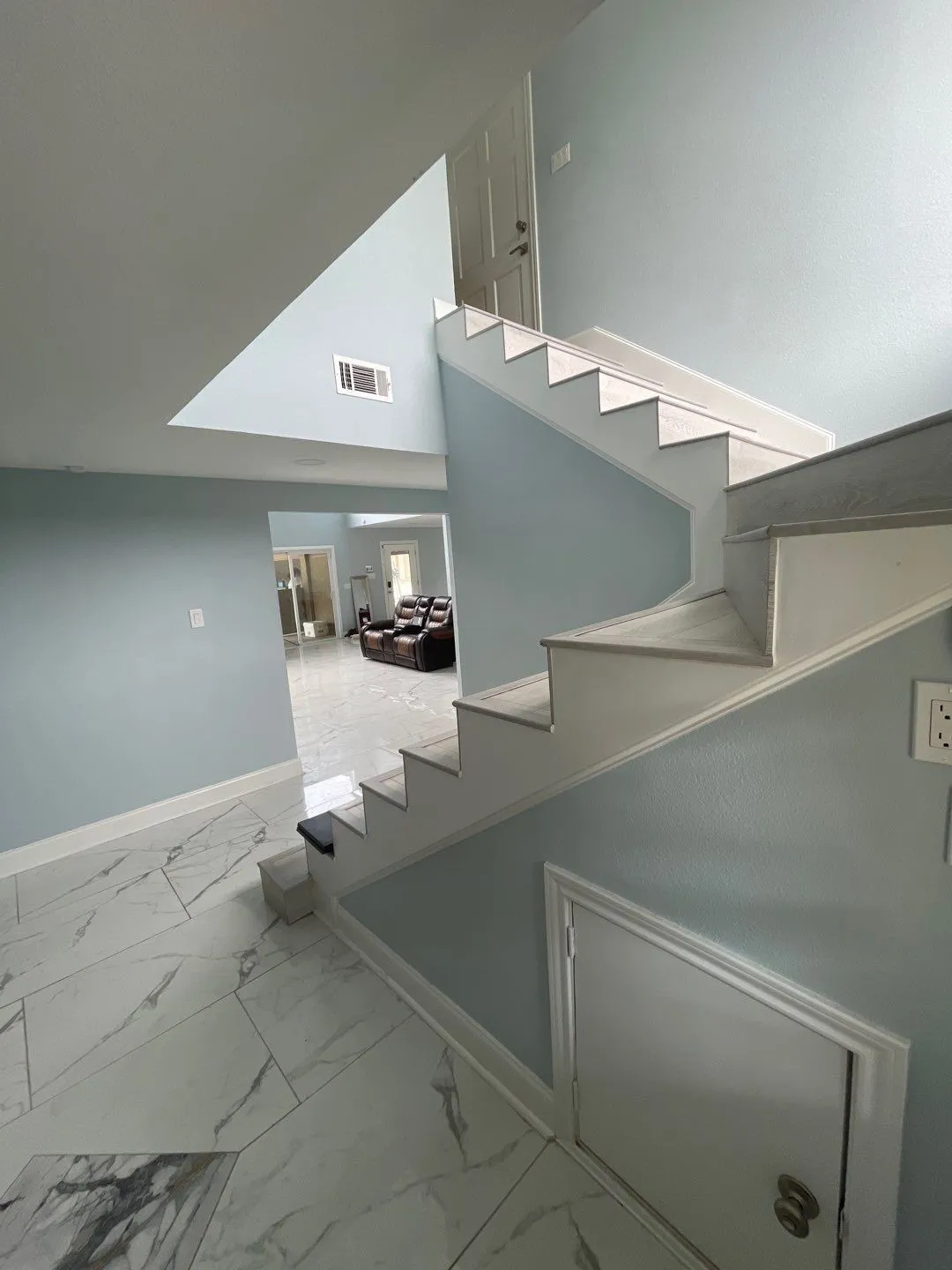 Stairway with a towering ceiling