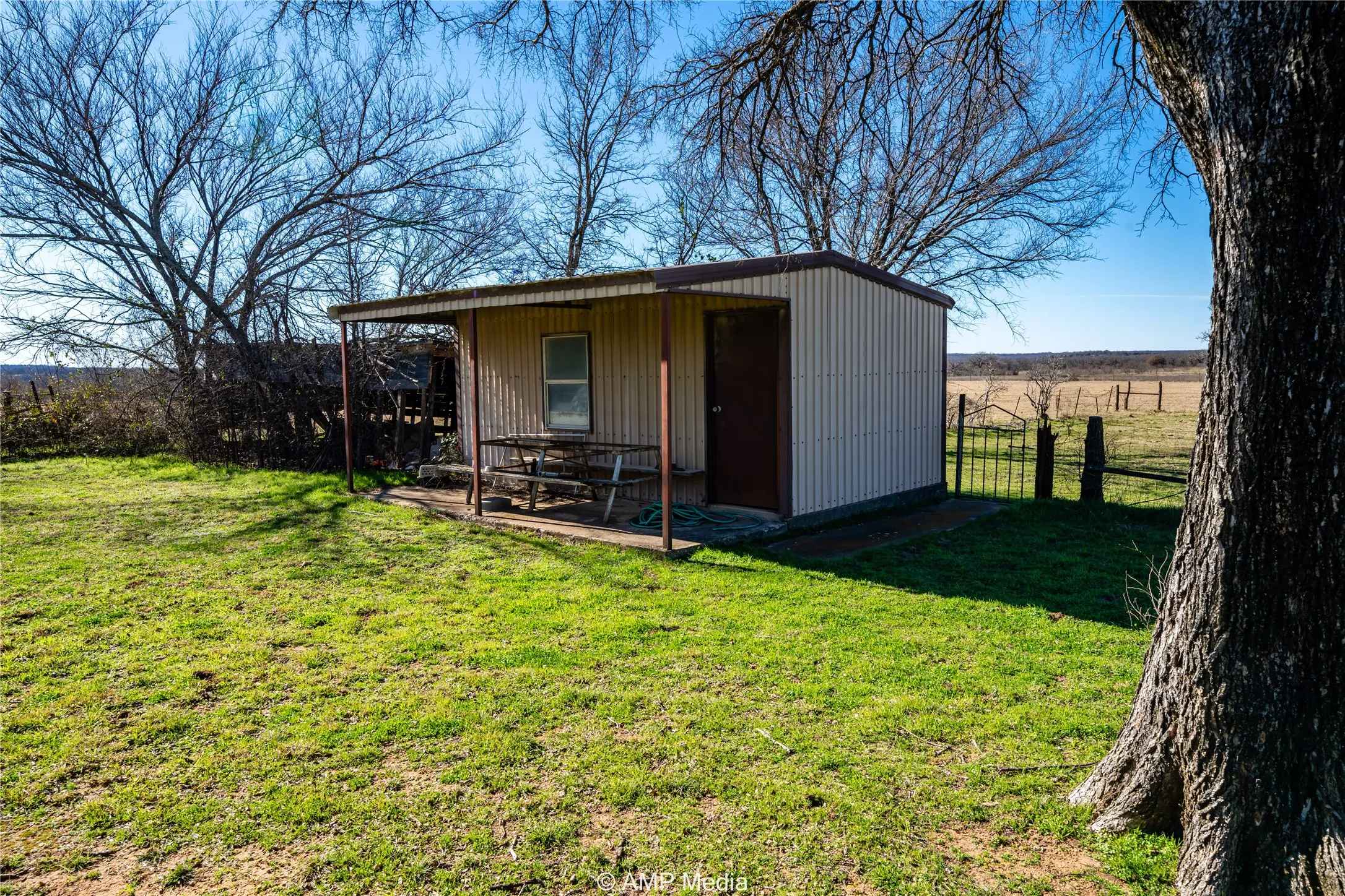 View of outbuilding featuring a yard