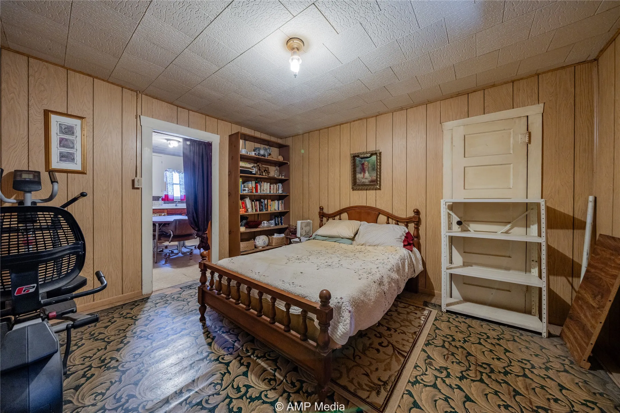Bedroom featuring wooden walls