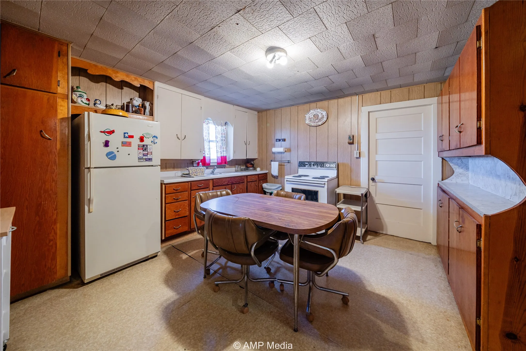 Kitchen featuring sink and white appliances
