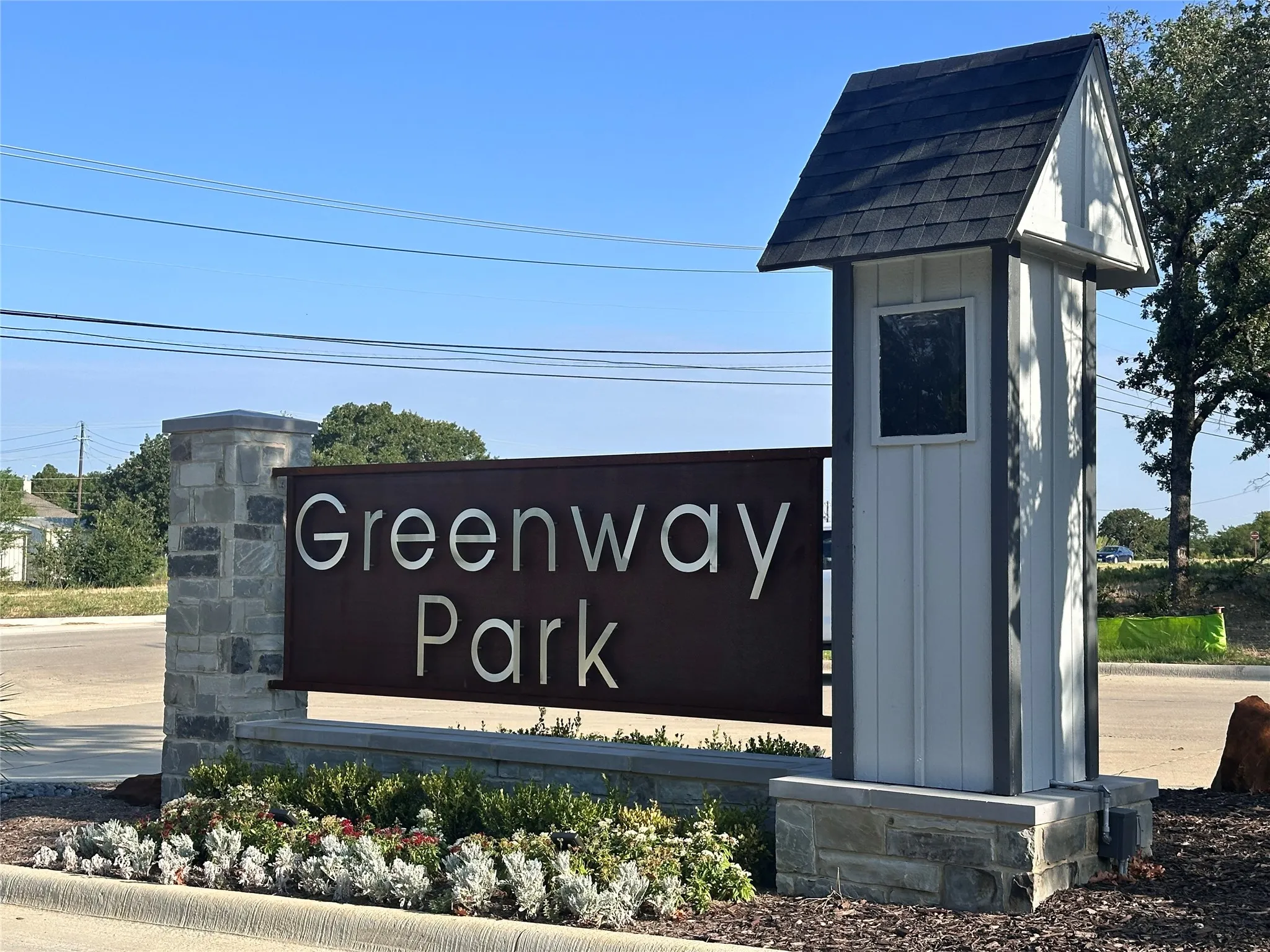 Greenway Park community entrance featuring a stone pillars