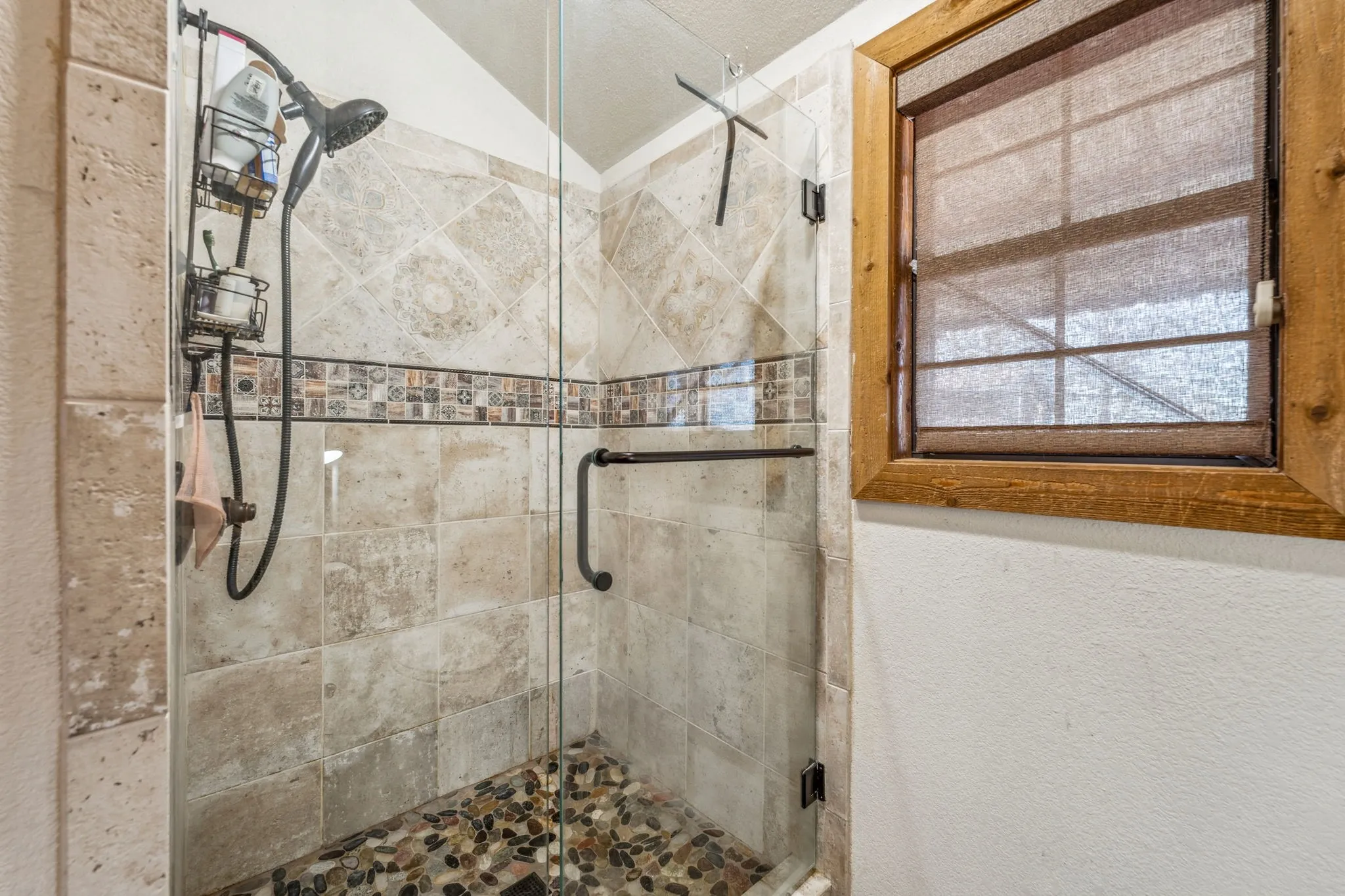 Full bathroom featuring a stall shower