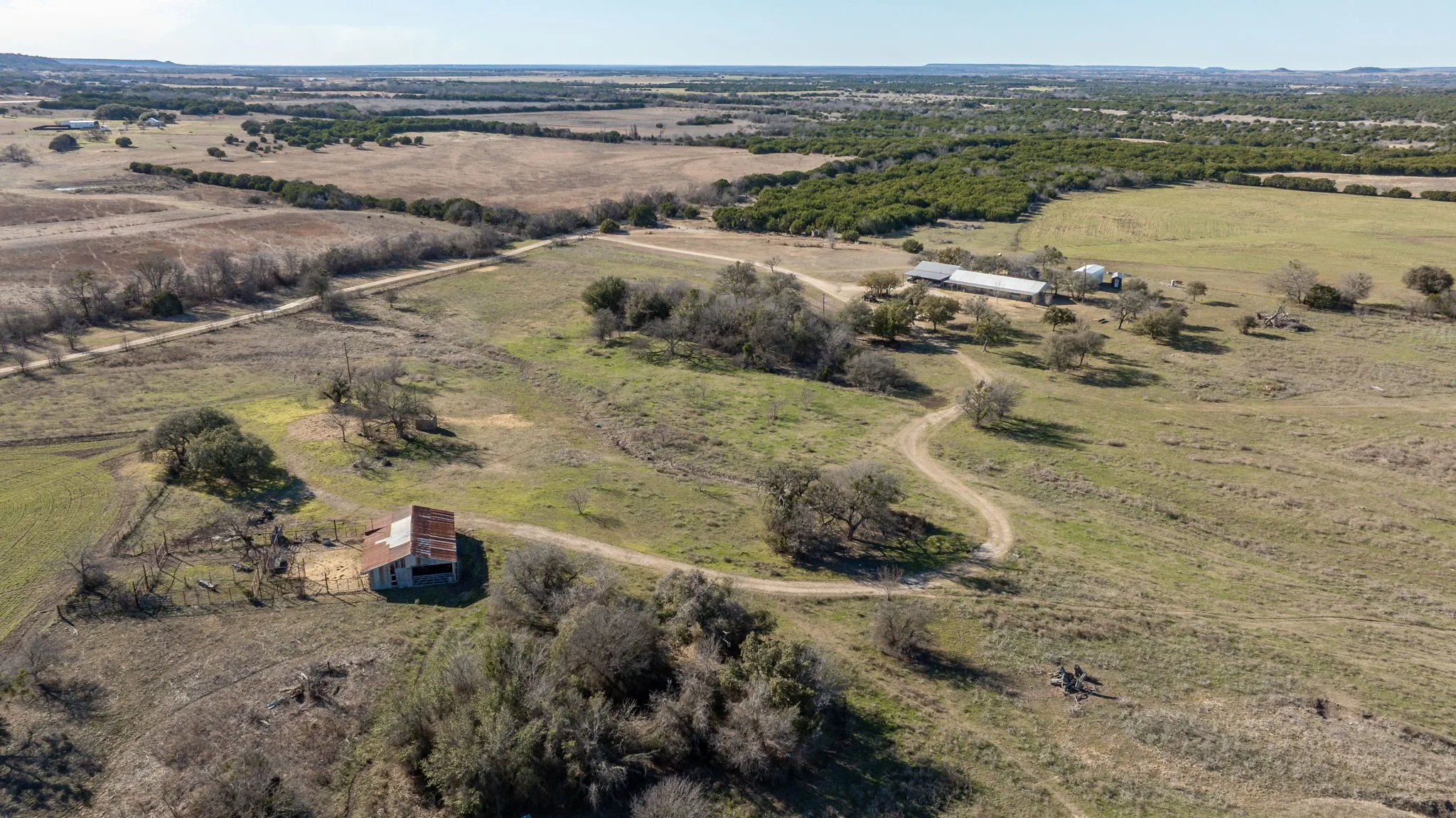 Birds eye view of property featuring a rural view