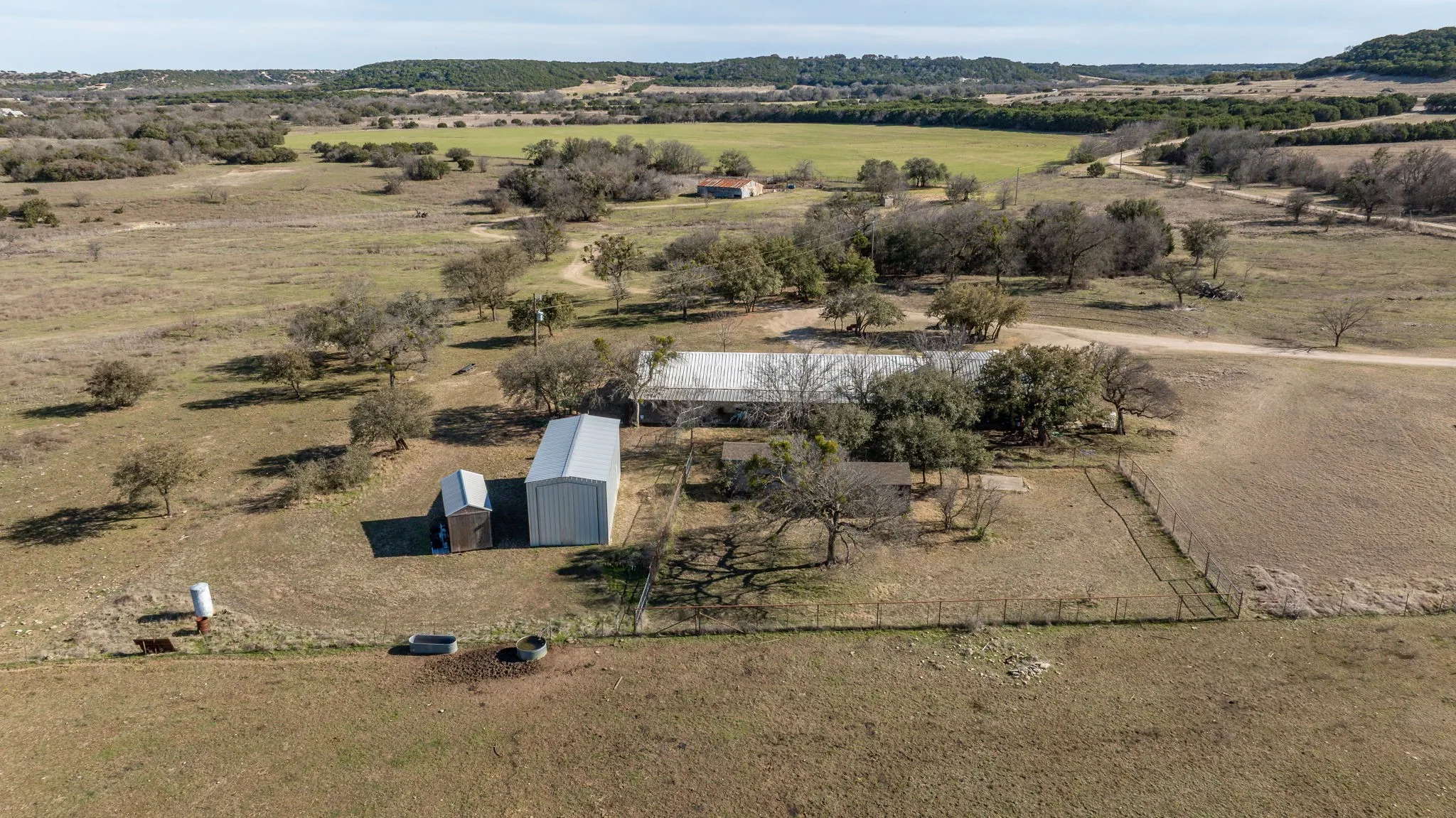 Birds eye view of property featuring a rural view