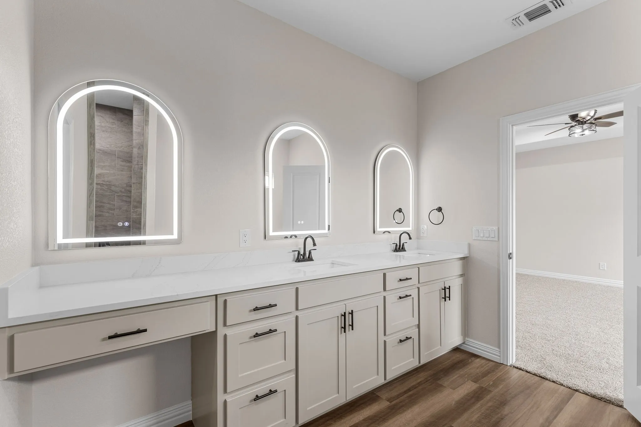 Bathroom with ceiling fan, vanity, and hardwood / wood-style floors