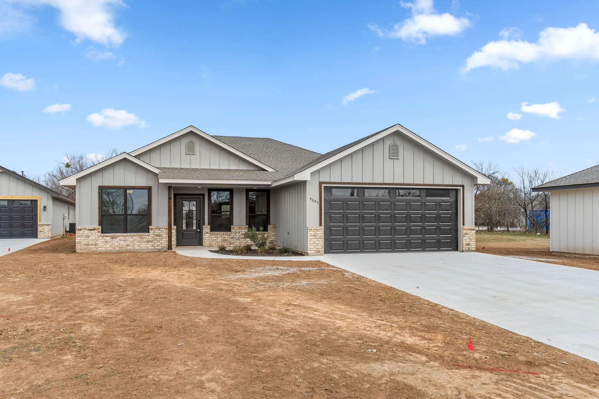 Modern farmhouse style home featuring a garage