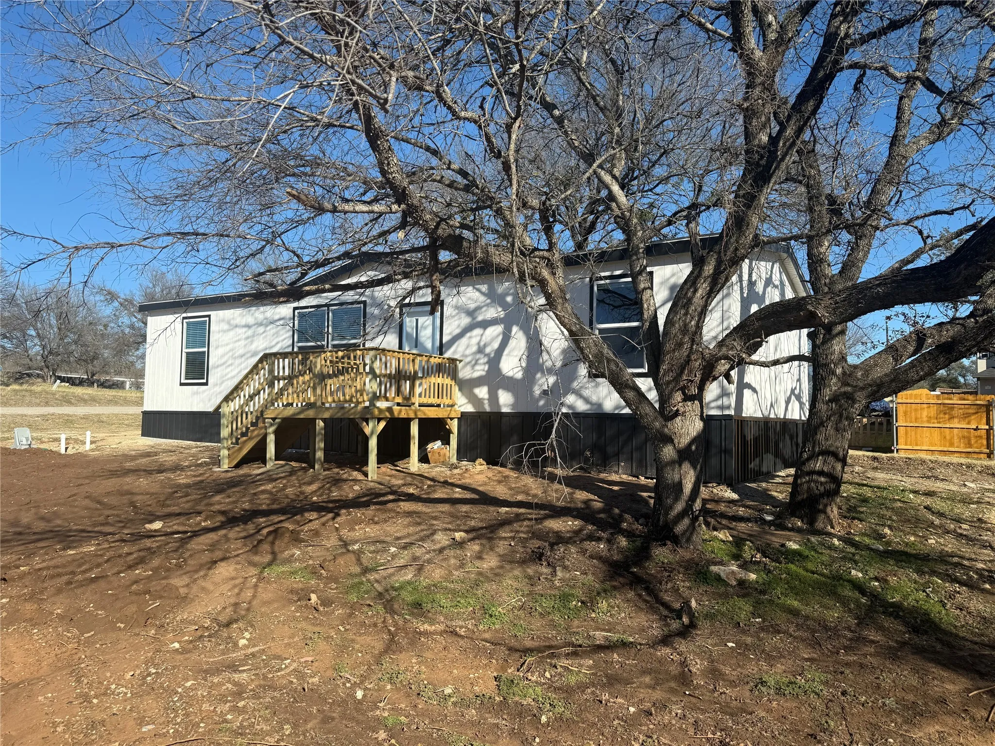 Back of house with a deck