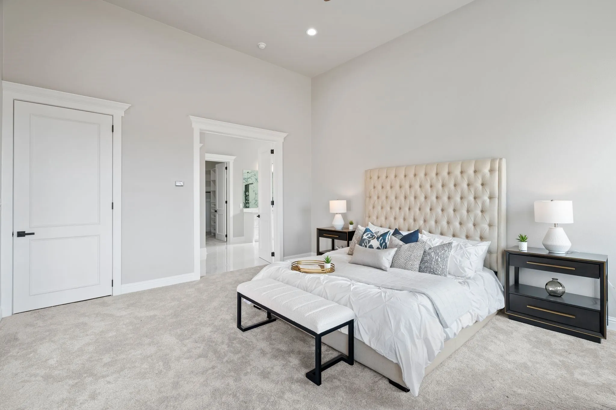 Bedroom with light colored carpet