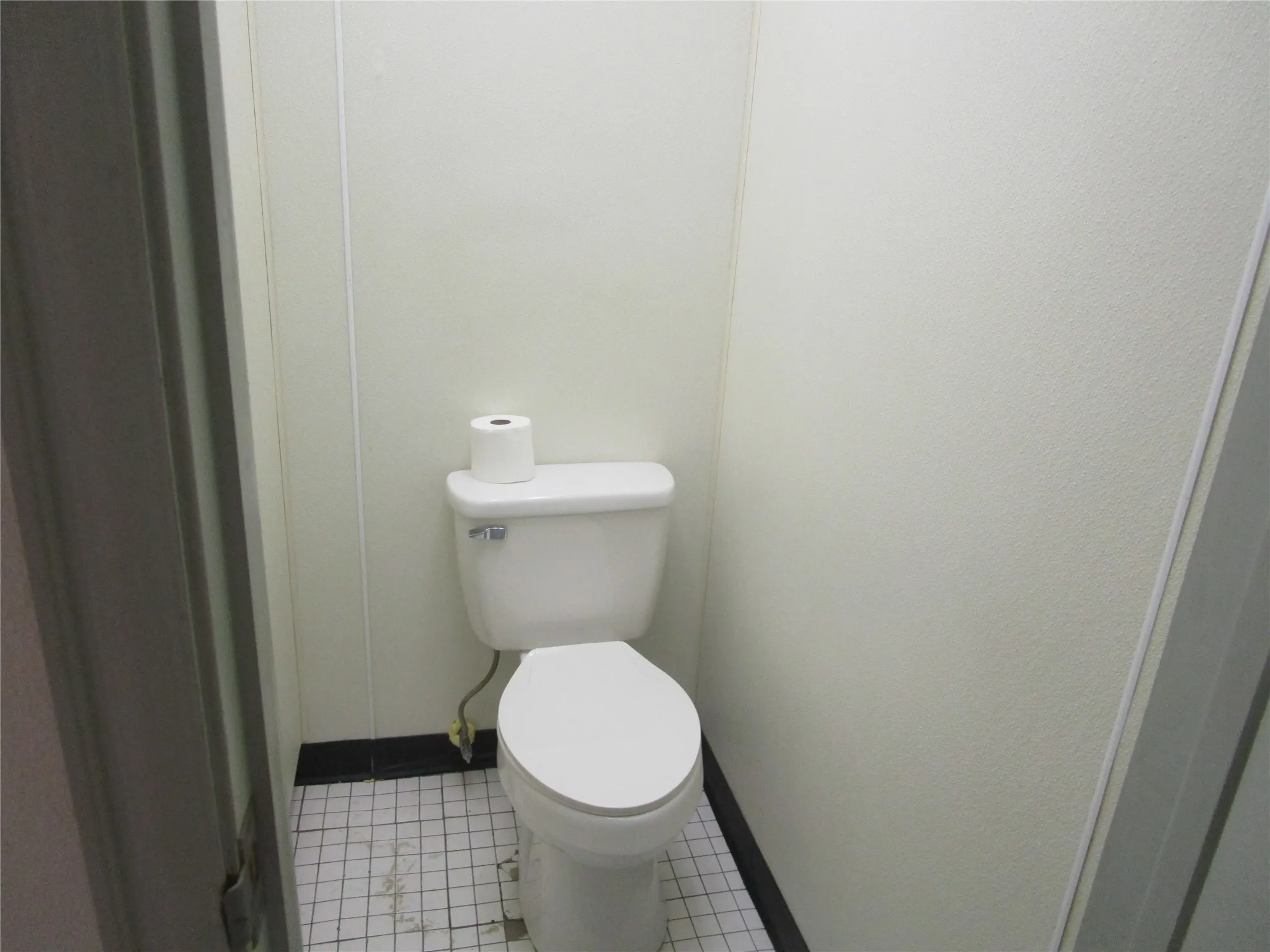 Bathroom with tile patterned flooring and toilet