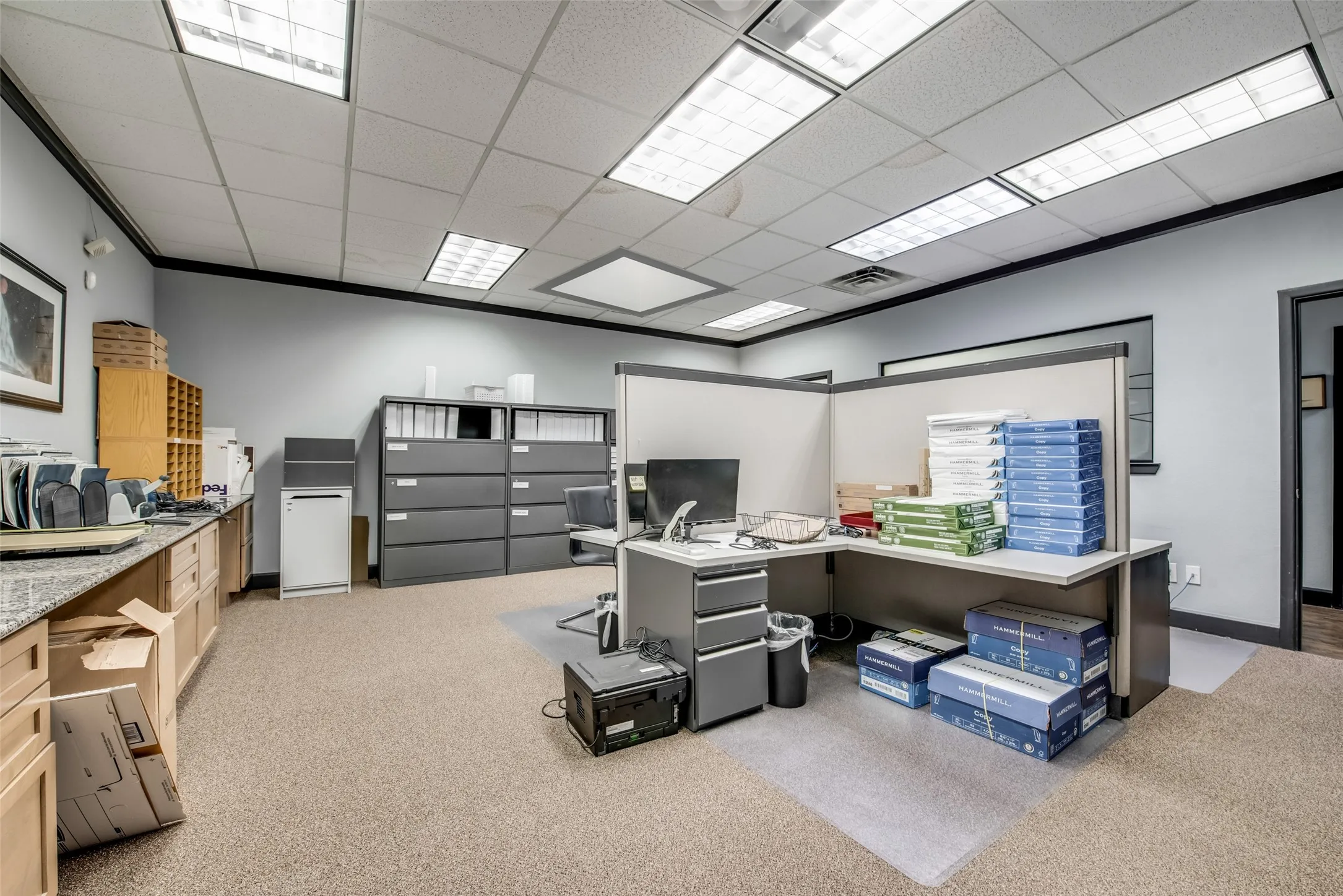 Office area featuring a drop ceiling