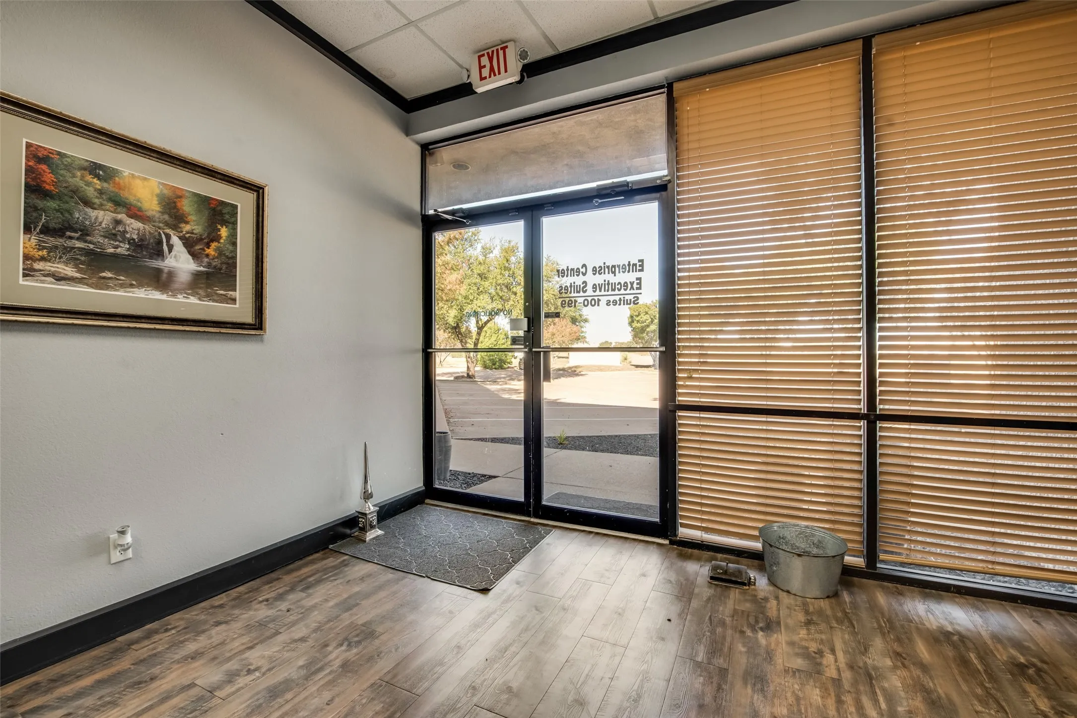 Entryway featuring hardwood / wood-style flooring and a paneled ceiling
