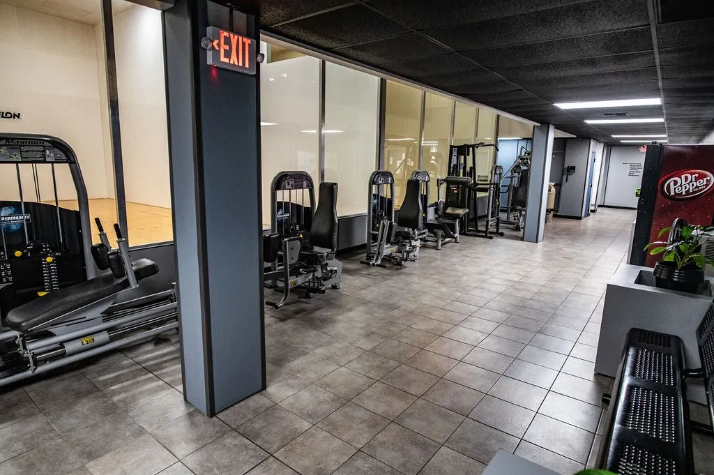 View of workout area with racquet ball courts