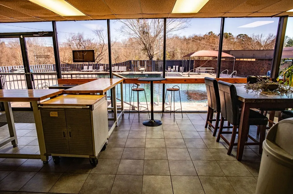 Sunroom with plenty of natural light looks over the pool and you can have snacks from the kitchen