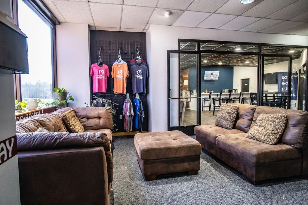 Lobby seating and a view into the cafe greets your members