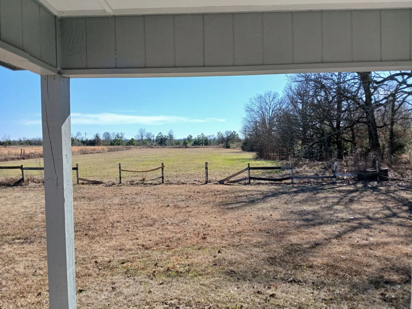 View of yard with a rural view