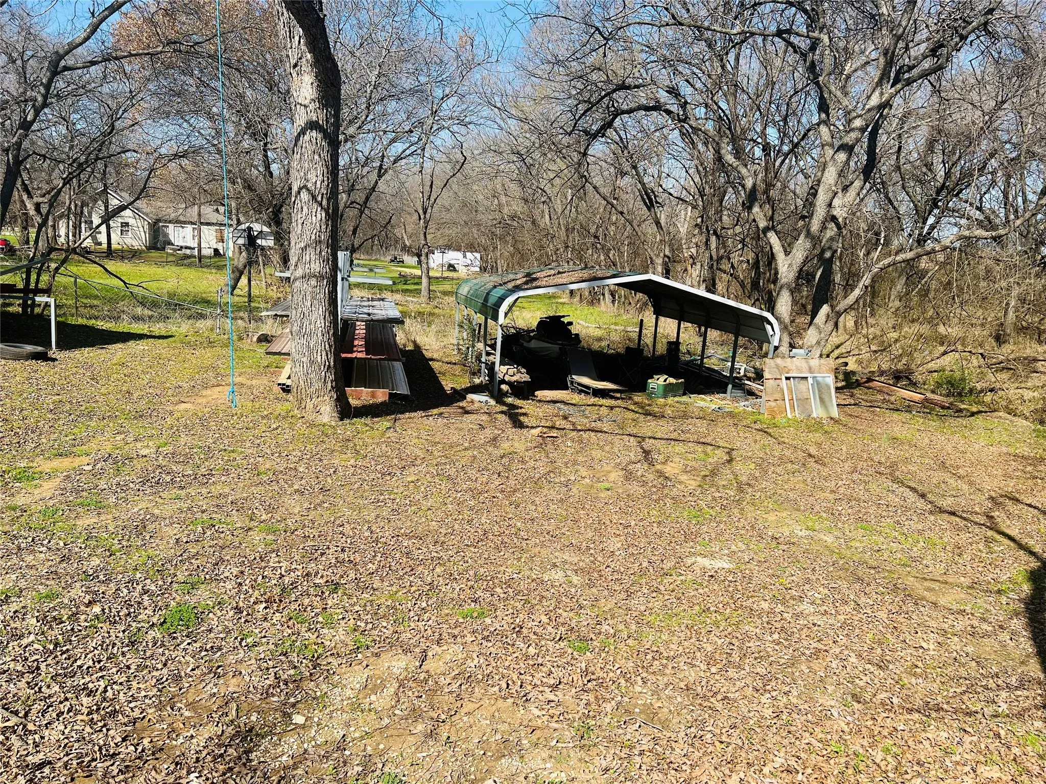 View of yard with a carport