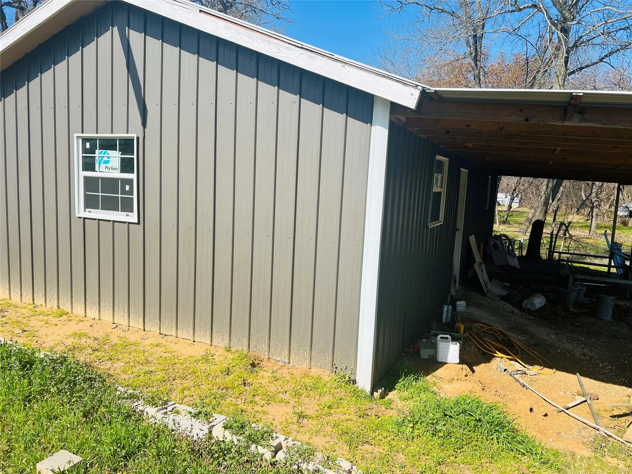 View of side of home featuring a carport