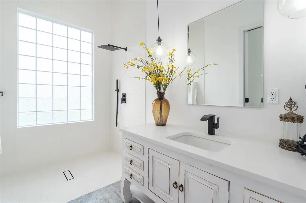 Bathroom with vanity and a shower
