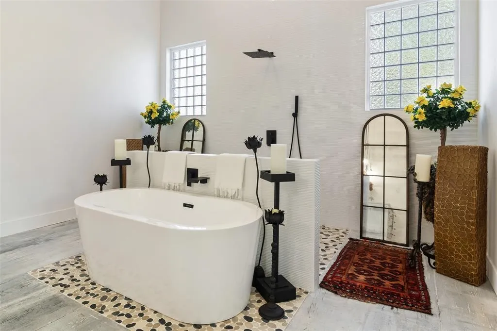 Bathroom featuring hardwood / wood-style floors and independent shower and bath
