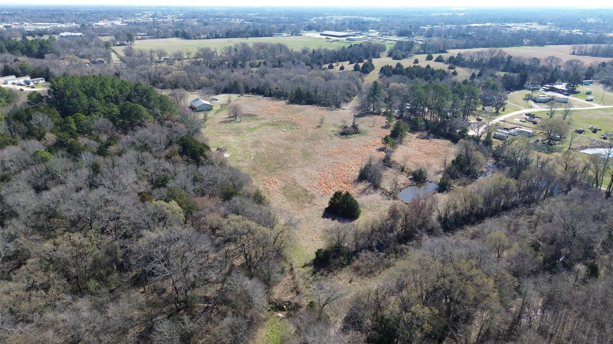 Aerial view of property and surrounding area featuring rural landscape