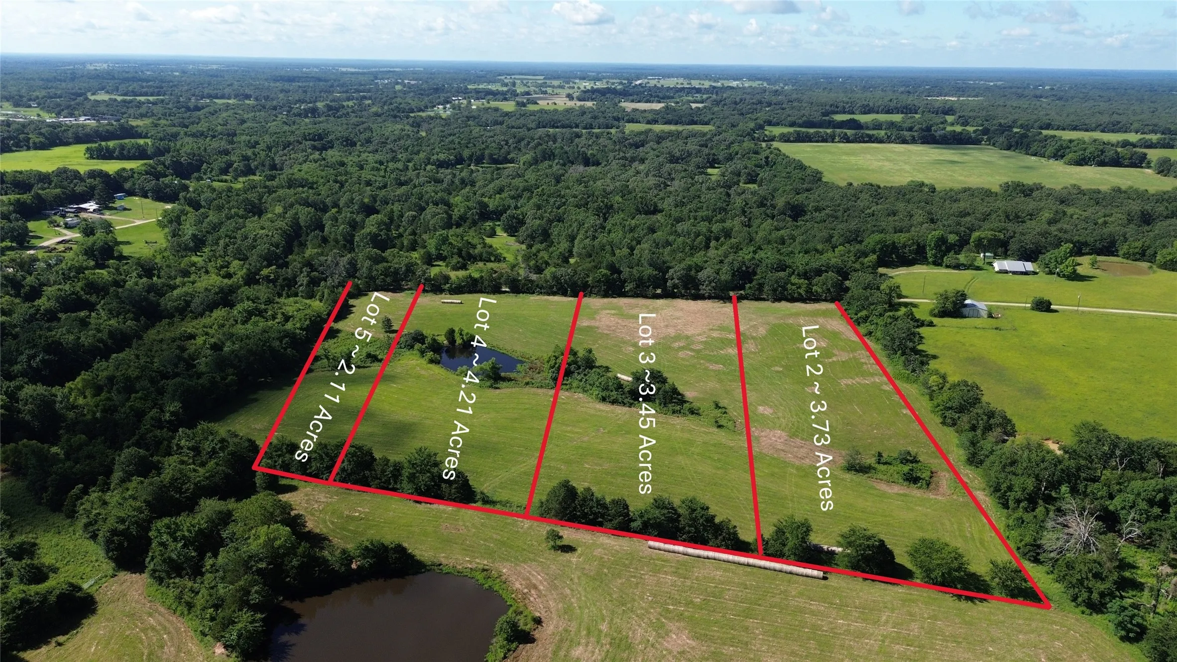 Aerial view of property's location featuring a heavily wooded area and property boundaries highlighted