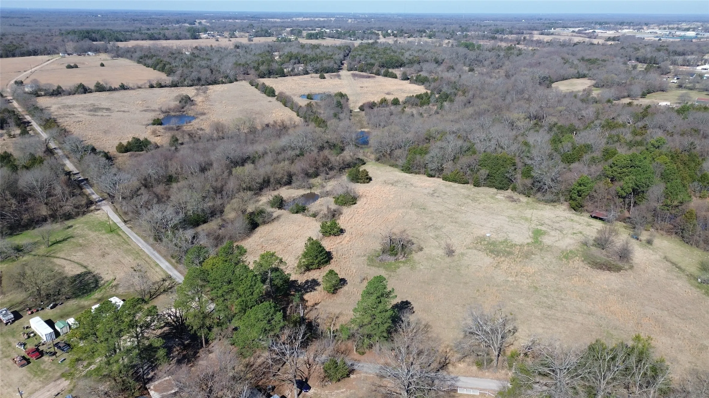 Birds eye view of property with a rural view