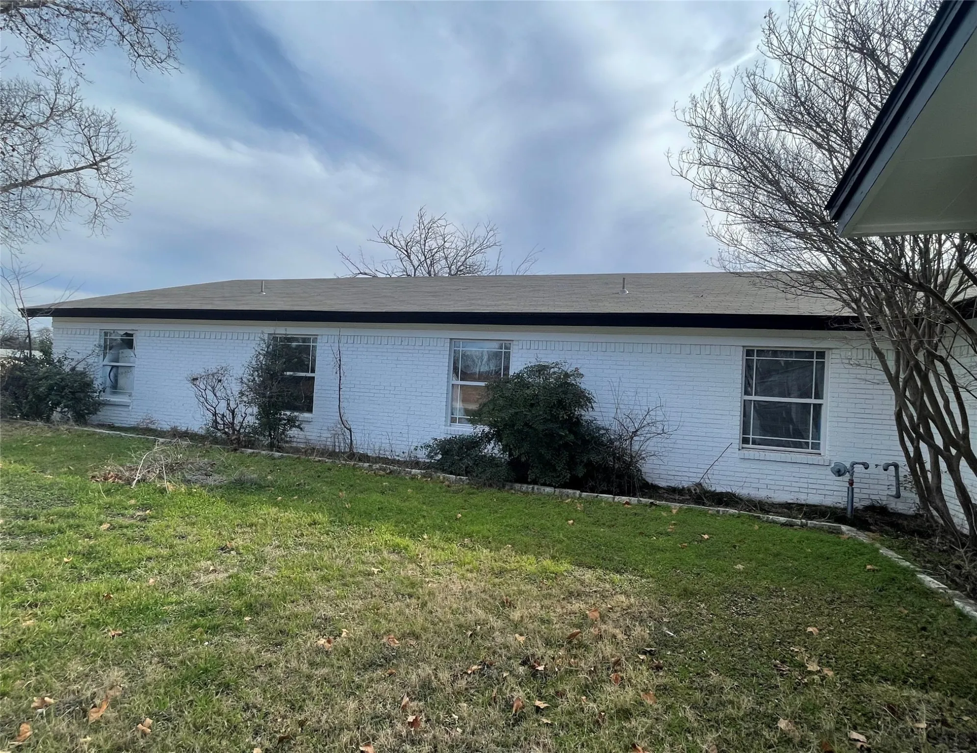 View of home's exterior featuring a yard