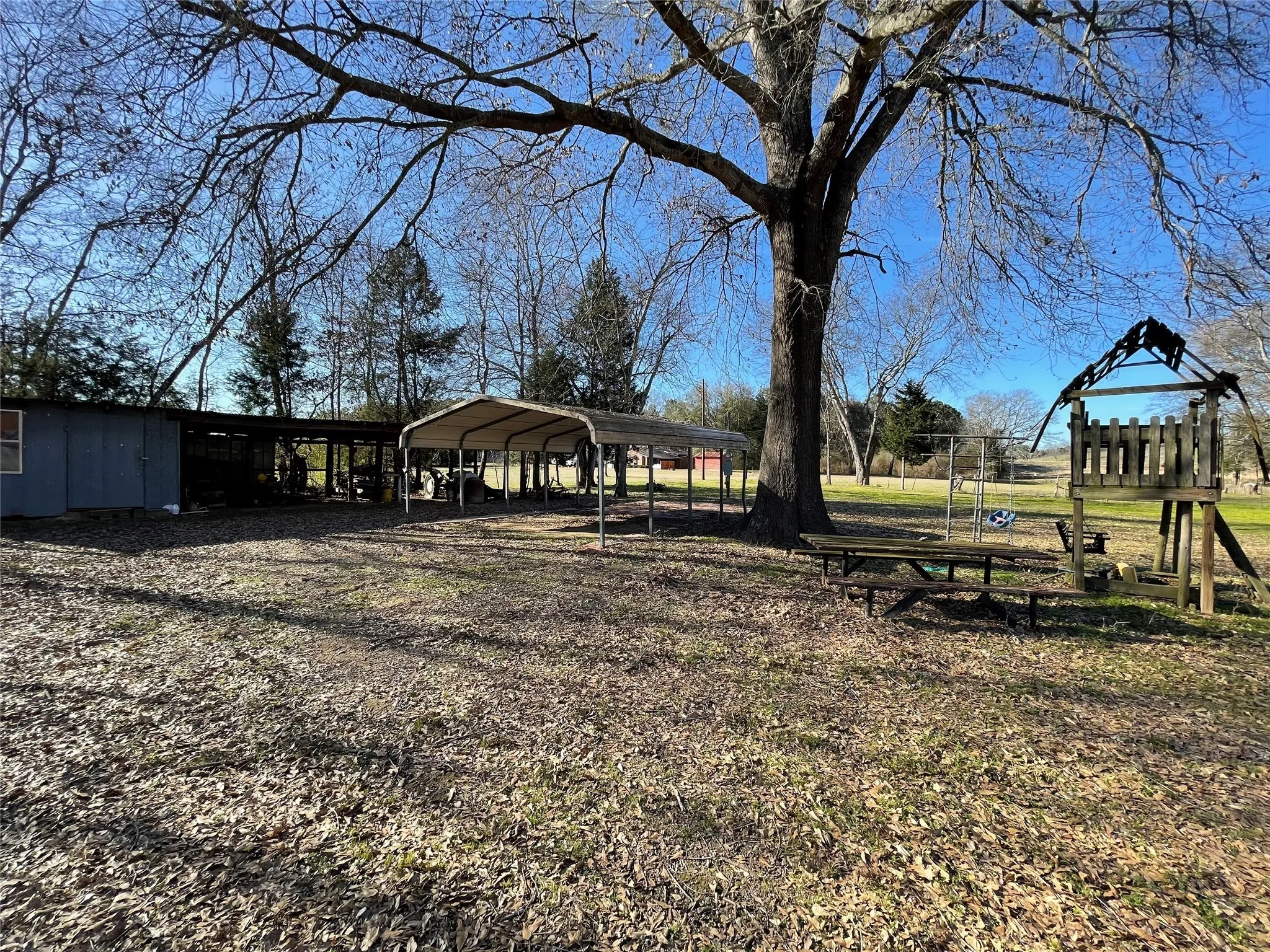 View of yard featuring a carport