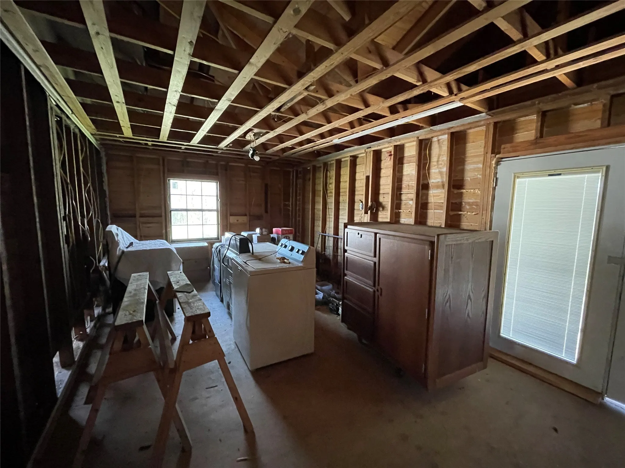 Misc room featuring a garage and washing machine and dryer