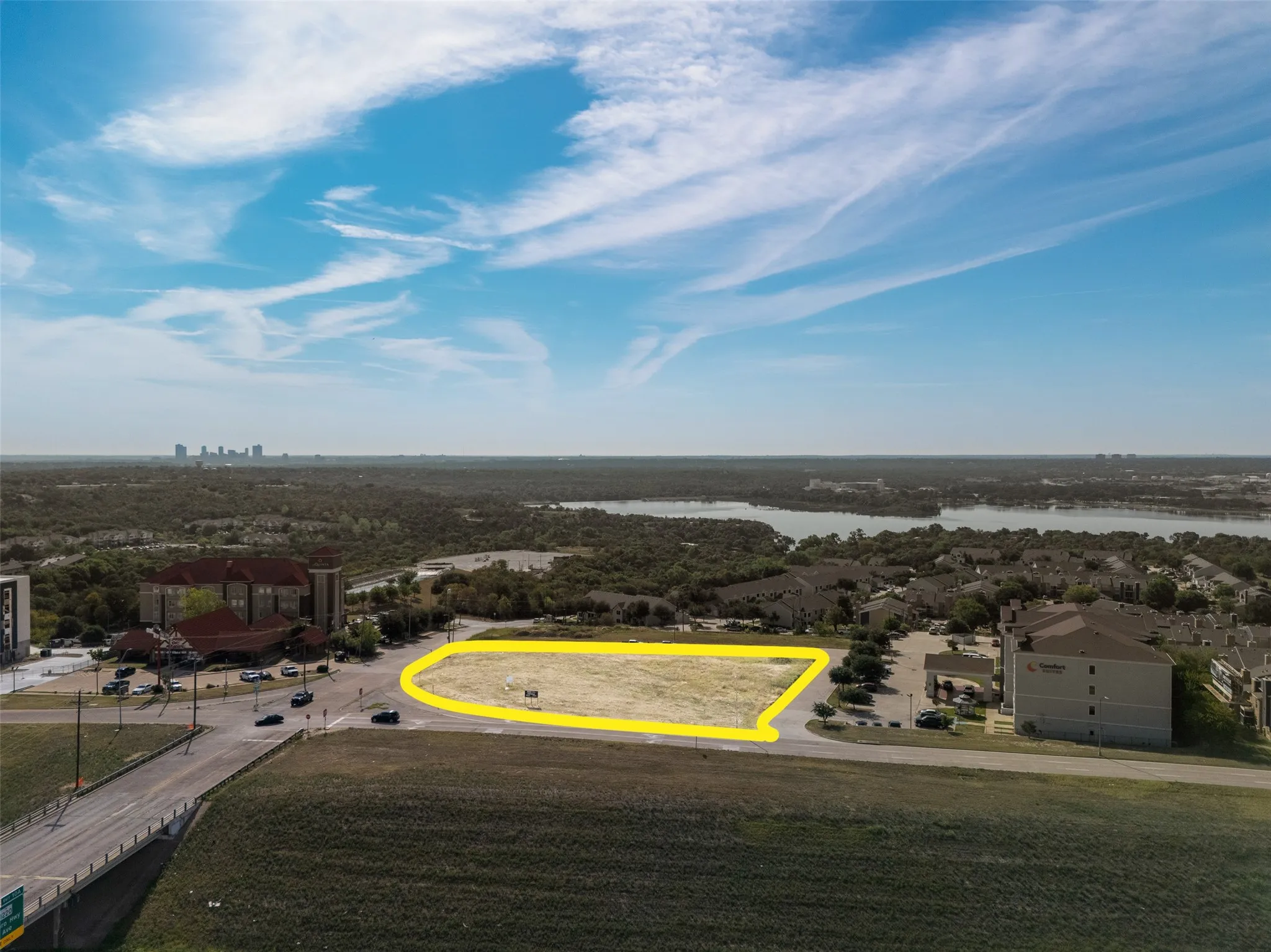 Aerial view of property's location featuring a nearby body of water and property boundaries highlighted