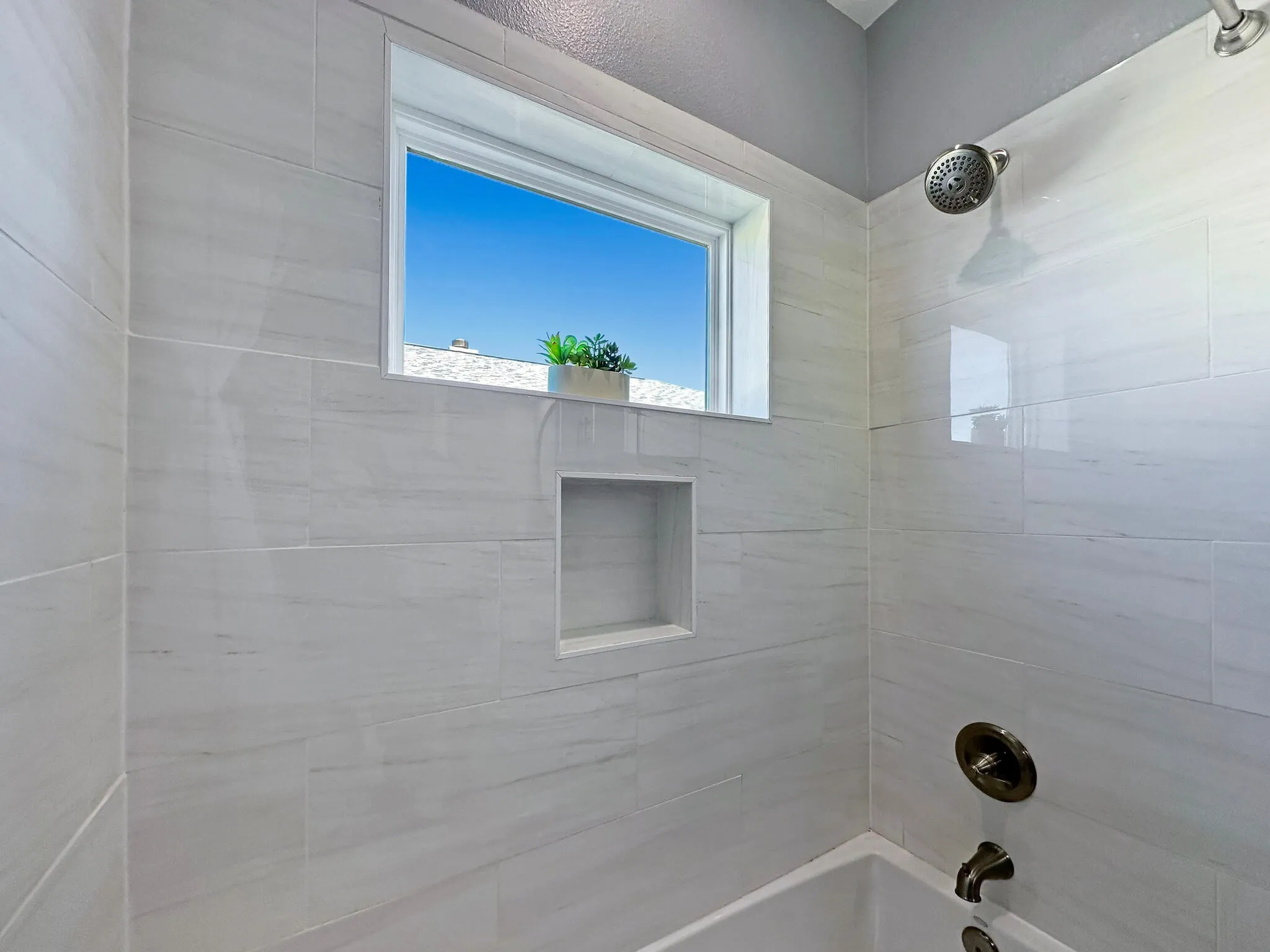 Full bathroom with shower / washtub combination