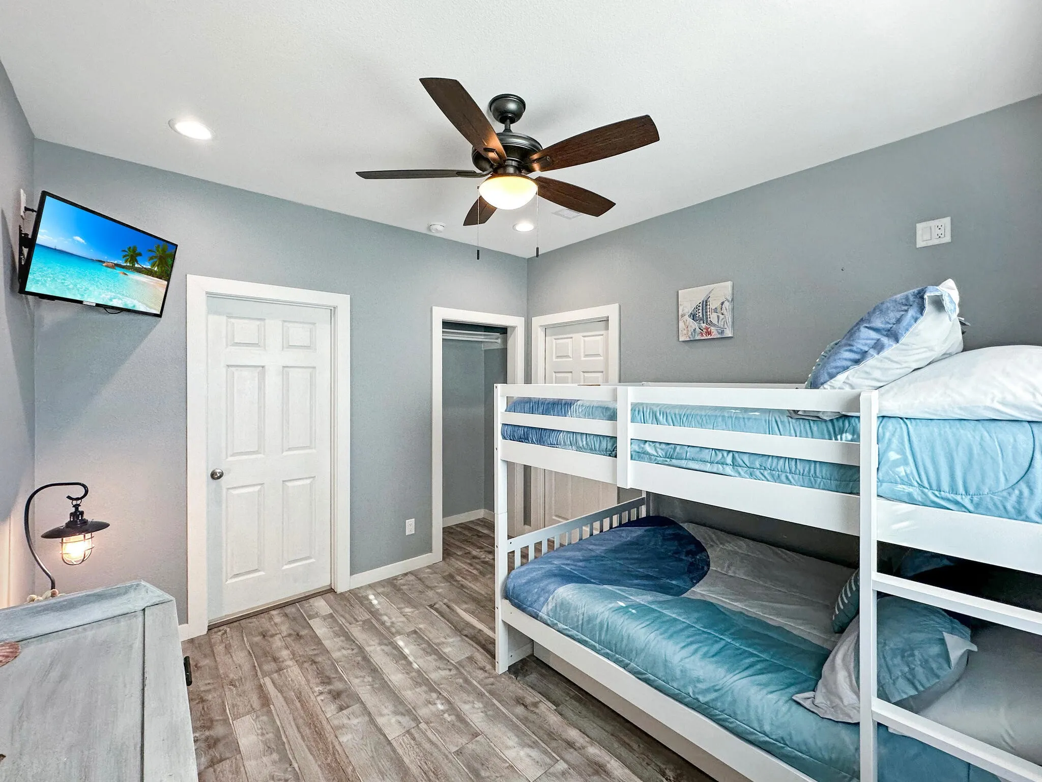 Bedroom featuring a ceiling fan, baseboards, wood finished floors, and recessed lighting