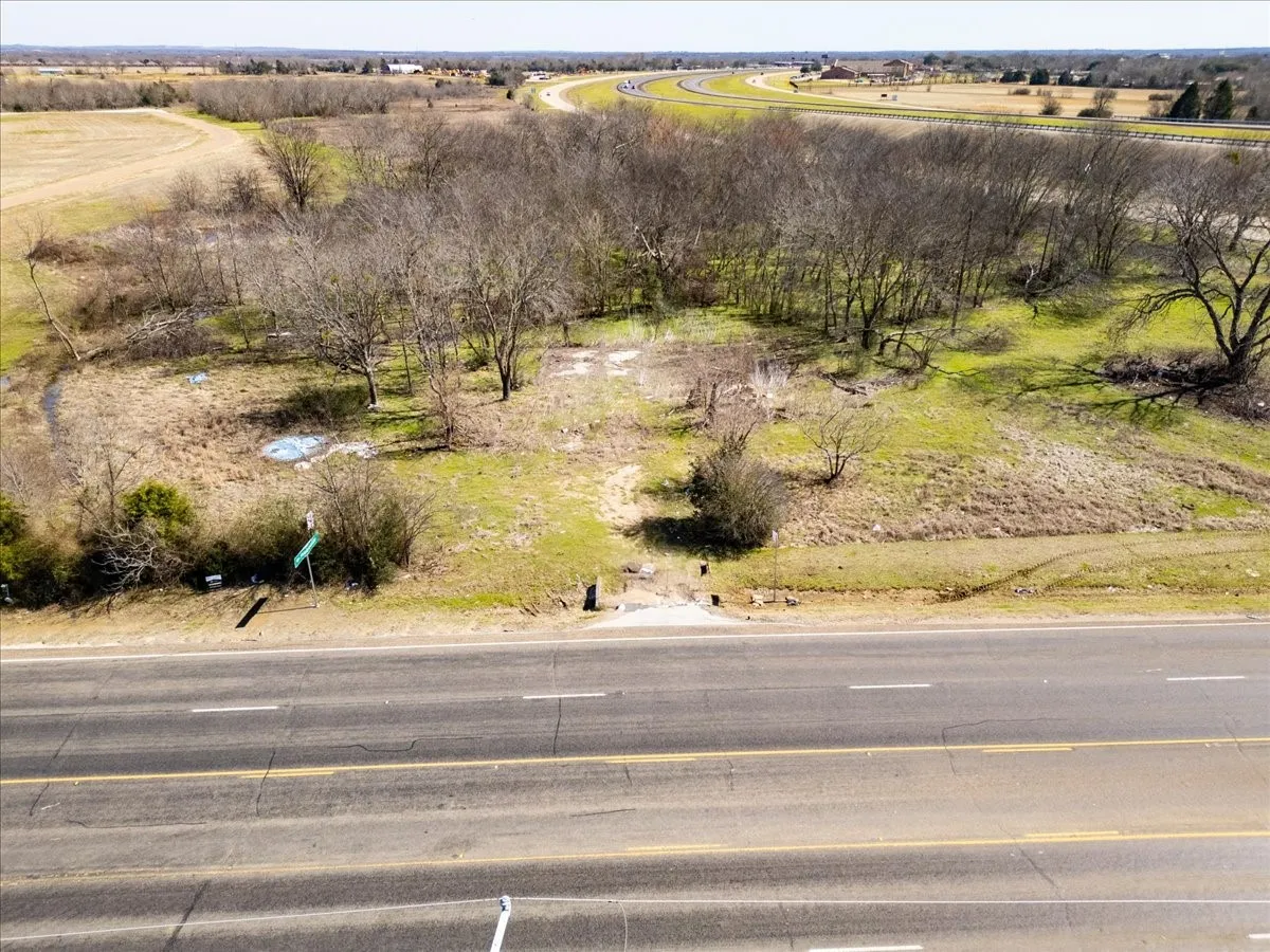 Birds eye view of property with a rural view