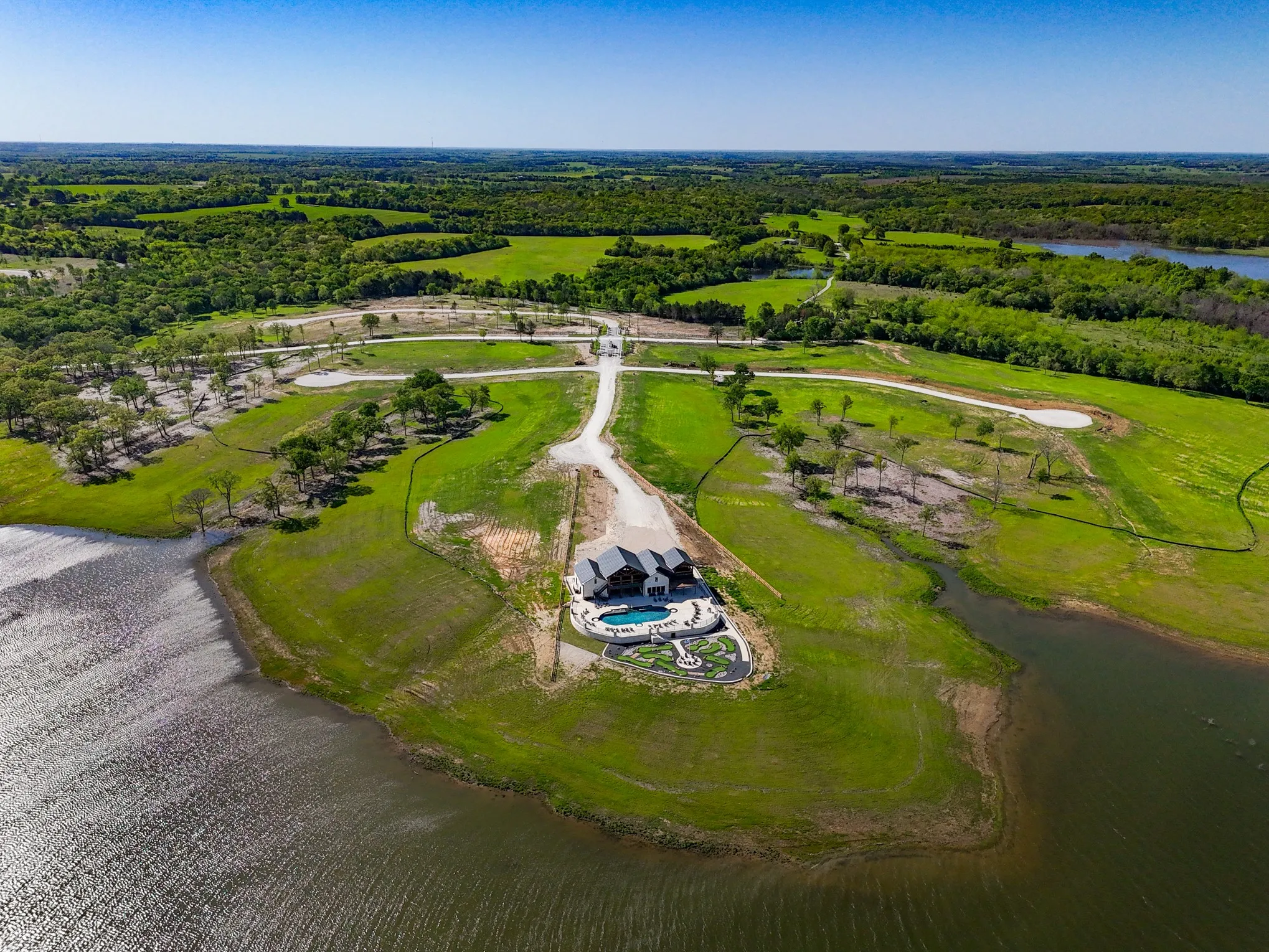 Bird's eye view with a forest view and a water view