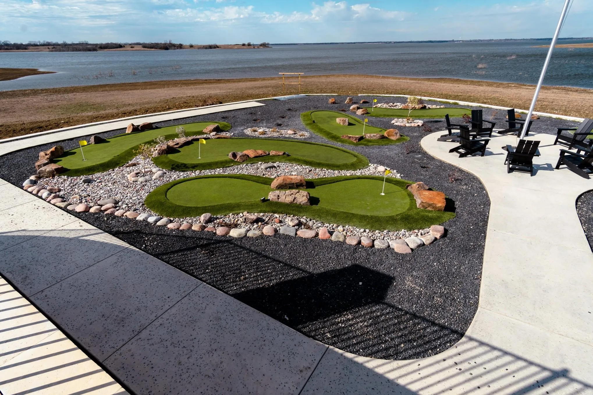 View of property's community featuring a water view and a patio area