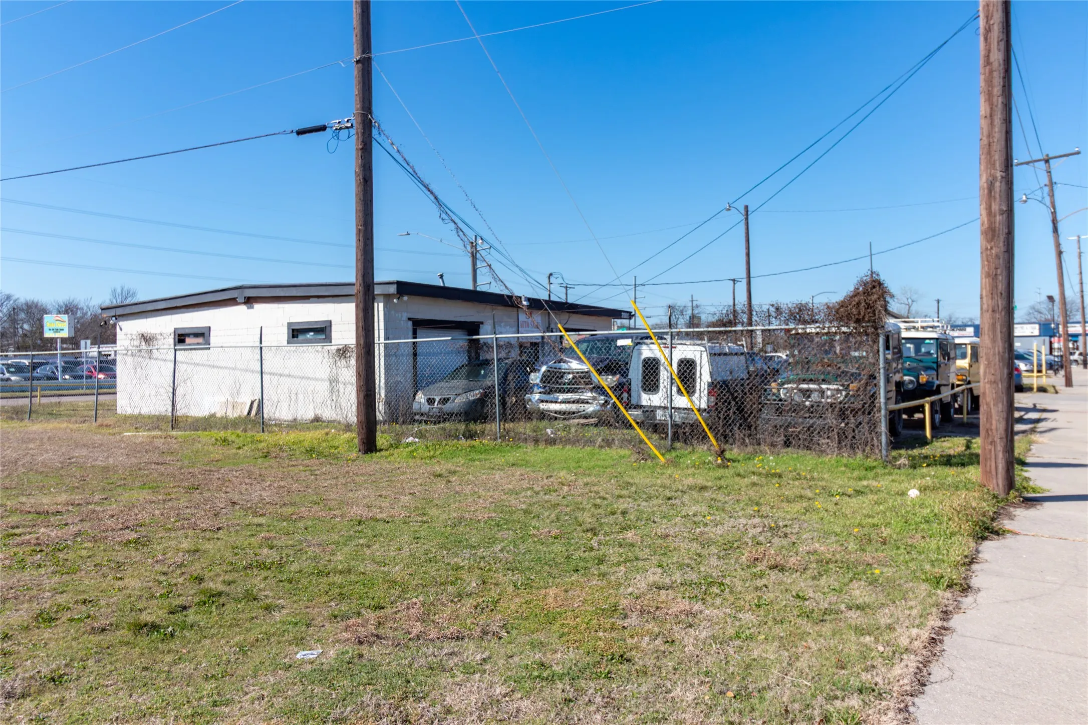 View of outbuilding with fence