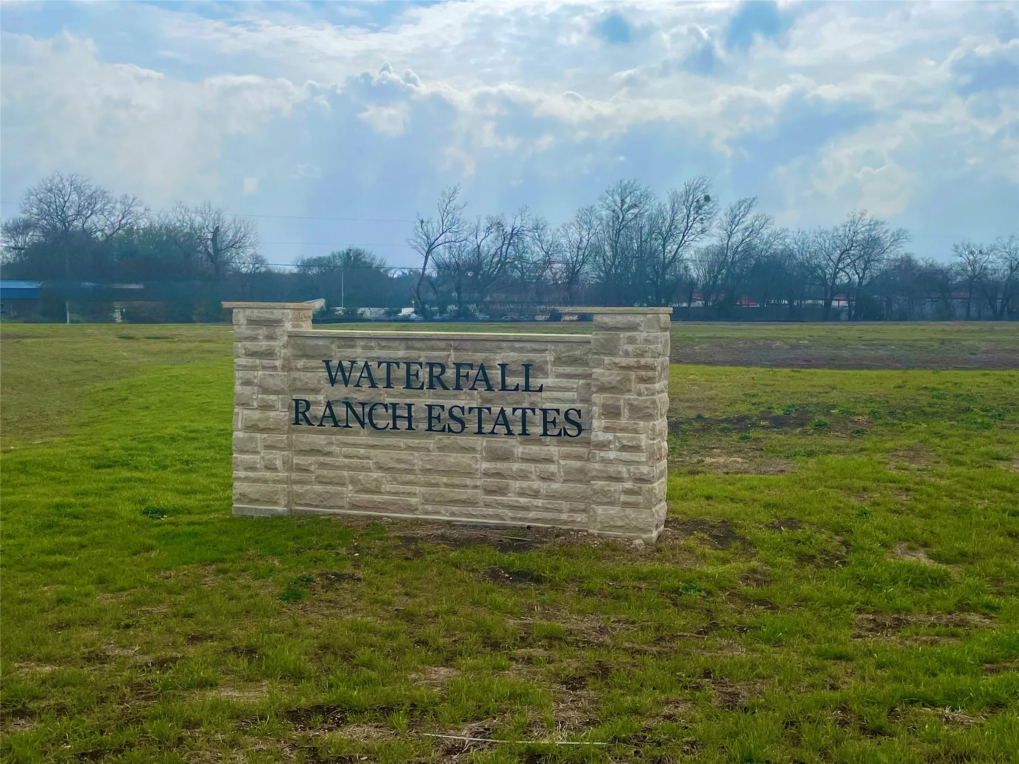 Community sign with a lawn