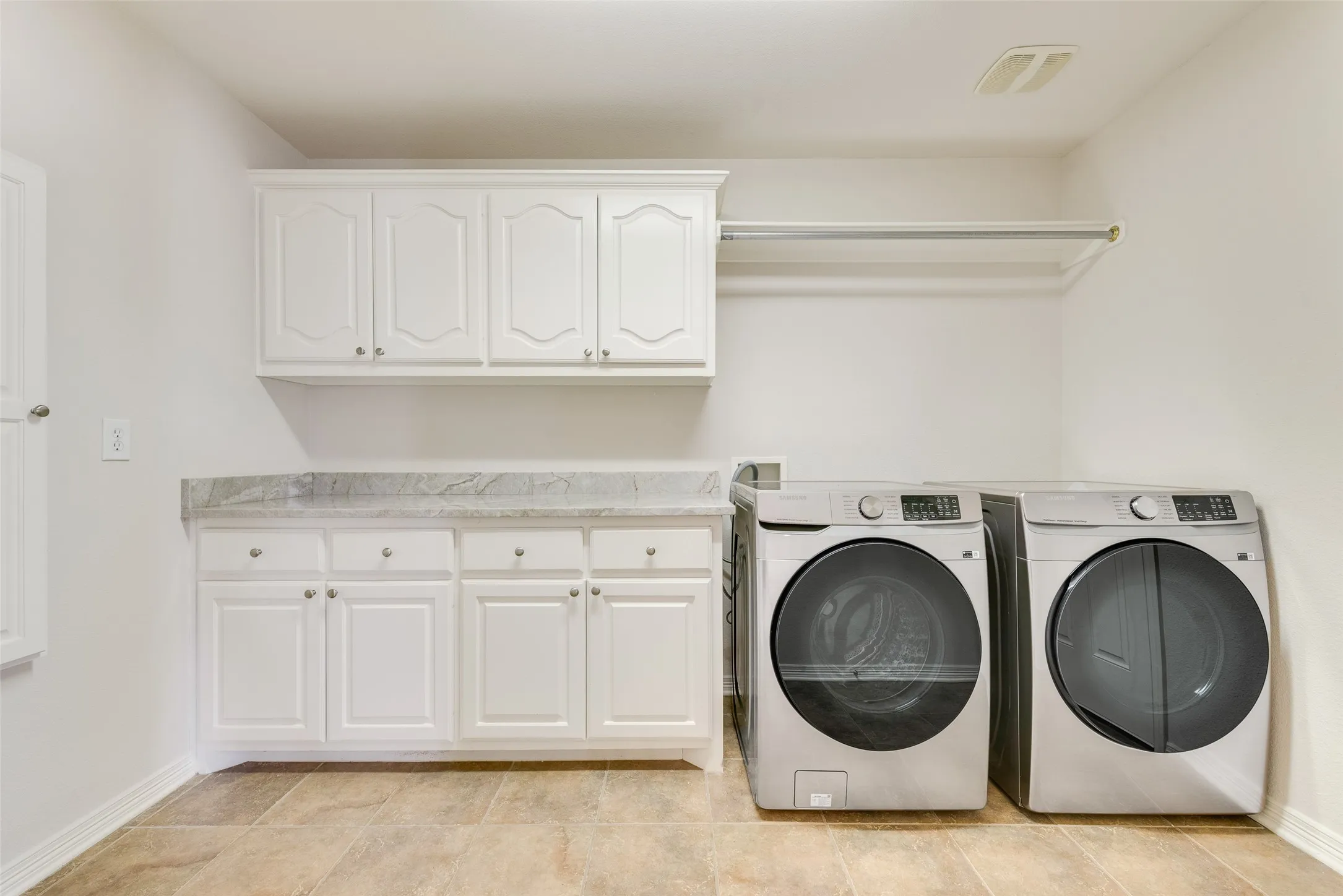 11x8 dedicated laundry room with built-in cabinets