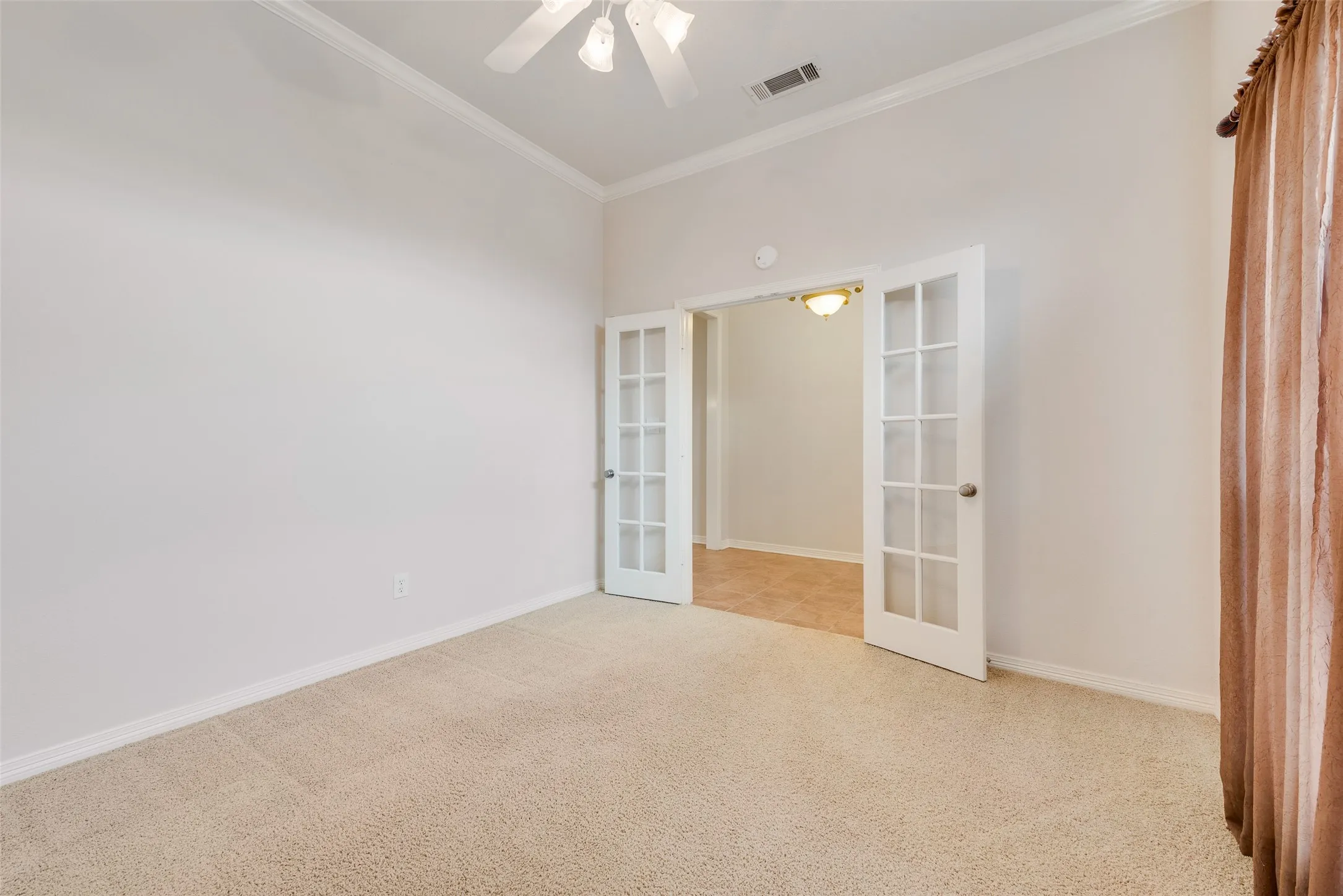 12x11 Office with carpet flooring and ceiling fan