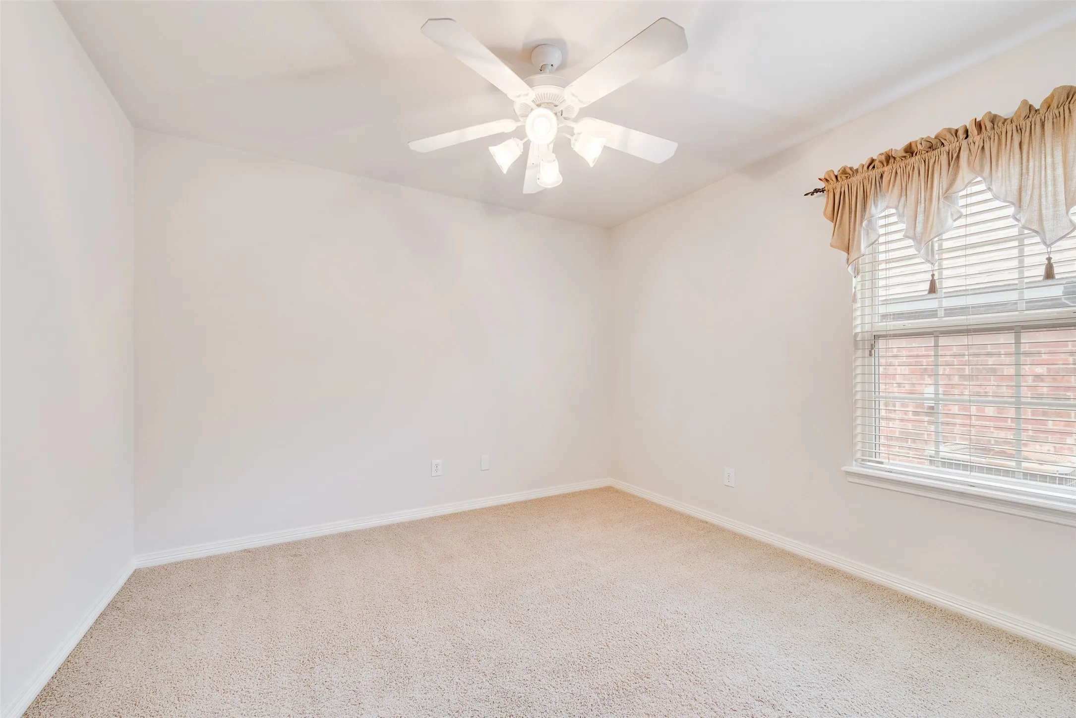 12x11 Bedroom with carpet flooring and ceiling fan