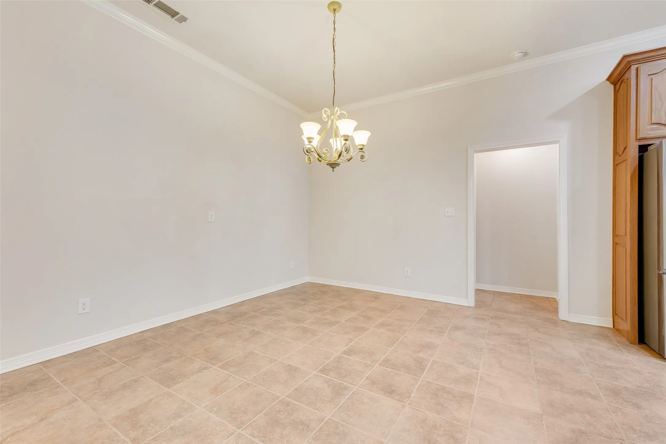 Dining area with chandelier lighting