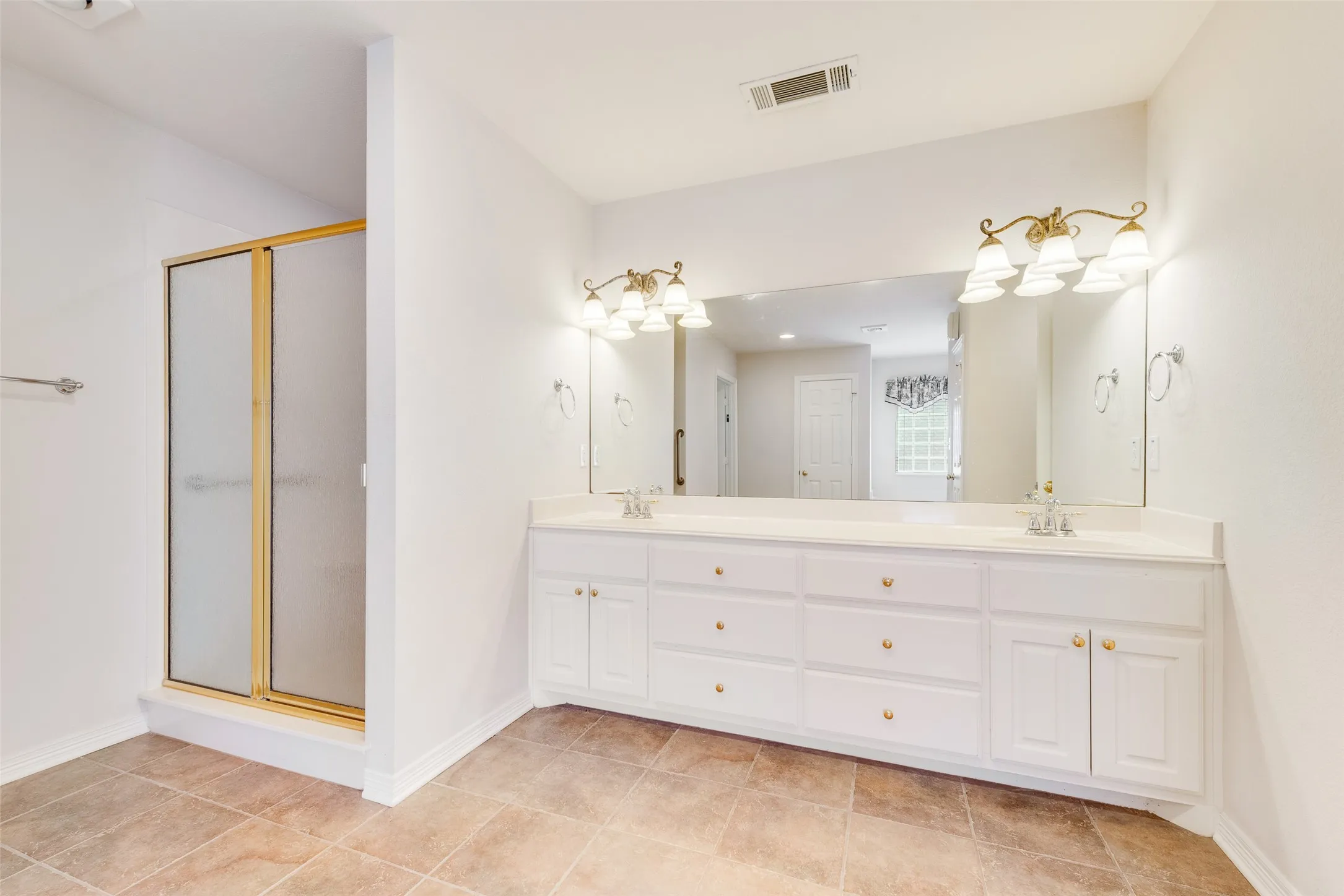 Ceramic tile floors with separate shower/tub and dual sinks